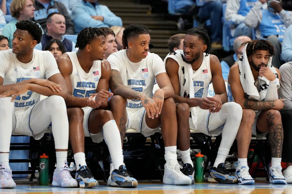 Tar Heels players Jalen Washington (13), Harrison Ingram (55), Armando Bacot (5), Jae'Lyn Withers (24) and RJ Davis have helped lead North Carolina to a No. 3 national ranking.