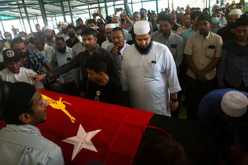 People attend at a funeral of NLD's ward chairman U Khin Maung Latt in Yangon