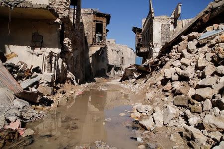 Debris are seen floating in water in the old city of Aleppo, Syria March 24, 2017. Picture taken March 24, 2017. REUTERS/Omar Sanadiki