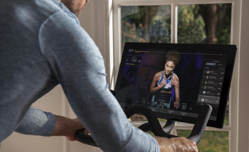 A user on a Peloton indoor bicycle (via Peloton)