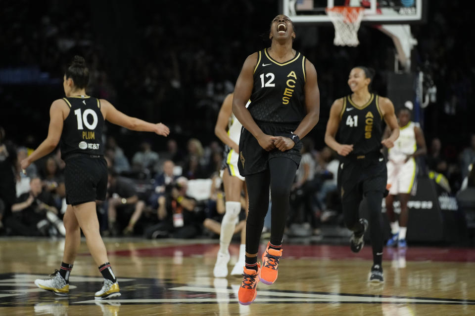 Las Vegas Aces guard Chelsea Gray (12) celebrates after a play against the Dallas Wings during the second half in Game 2 of a WNBA basketball semifinal series Tuesday, Sept. 26, 2023, in Las Vegas. (AP Photo/John Locher)