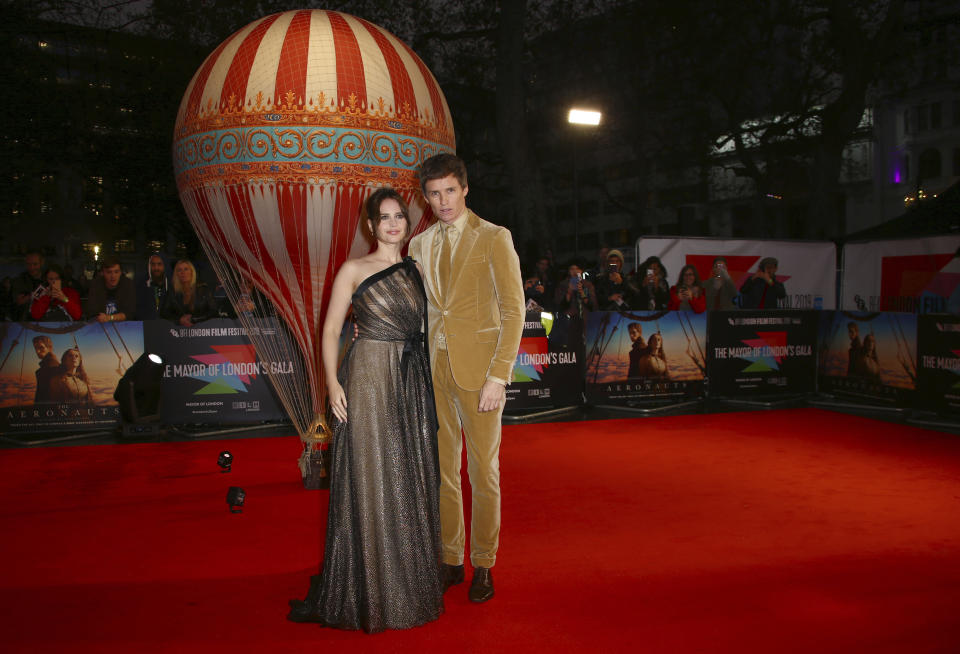 Actors Felicity Jones, left, and Eddie Redmayne pose for photographers upon arrival at the premiere of the film 'The Aeronauts' which is screened as part of the London Film Festival, in central London, Monday, Oct. 7, 2019. (Photo by Joel C Ryan/Invision/AP)