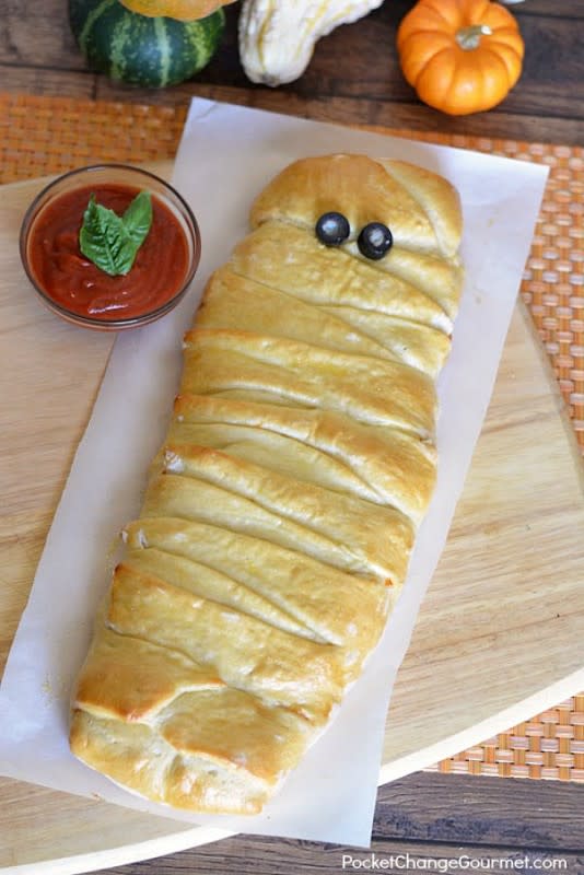 <p>Pocket Change Gourmet</p><p>Creepy enough to make you want your mummy, umm, mommy.</p><p><strong>Get the recipe: <a href="http://pocketchangegourmet.com/halloween-party-food-mummy-calzone/" rel="nofollow noopener" target="_blank" data-ylk="slk:Mummy Calzone;elm:context_link;itc:0;sec:content-canvas" class="link rapid-noclick-resp">Mummy Calzone</a></strong></p>