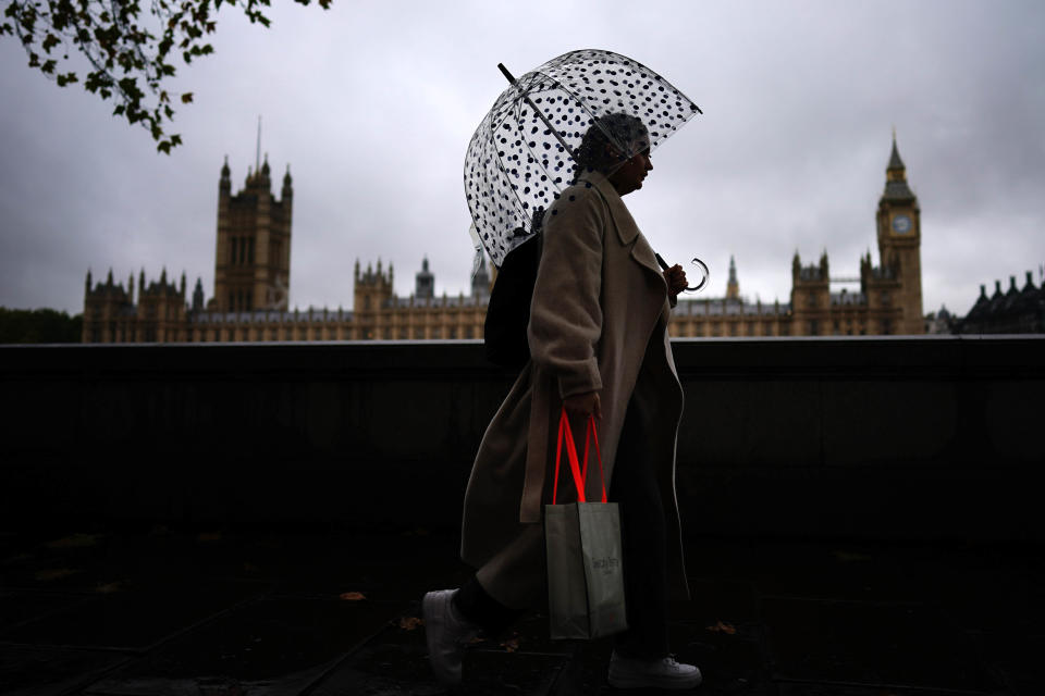 FTSE: Commuters with umbrellas on a rainy morning in Westminster, London. Picture date: Thursday November 3, 2022. (Photo by Aaron Chown/PA Images via Getty Images)