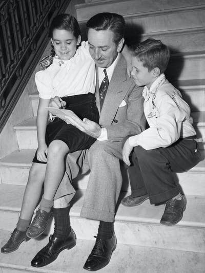 <span class="caption">While waiting to testify before the House Un-American Activities Committee, Walt Disney draws for the daughter of the chief counsel for the committee and the son of a committee investigator.</span> <span class="attribution"><a class="link " href="https://www.gettyimages.com/detail/news-photo/while-waiting-to-testify-before-the-house-unamerican-news-photo/514905244?adppopup=true" rel="nofollow noopener" target="_blank" data-ylk="slk:Bettmann/Getty Images;elm:context_link;itc:0;sec:content-canvas">Bettmann/Getty Images</a></span>