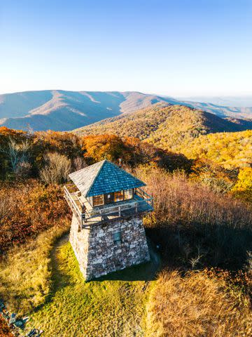 <p>Cedric Angeles</p> Get a bird's-eye view at High Knob Fire Tower, an observation deck located on the Virginia-West Virginia state line.