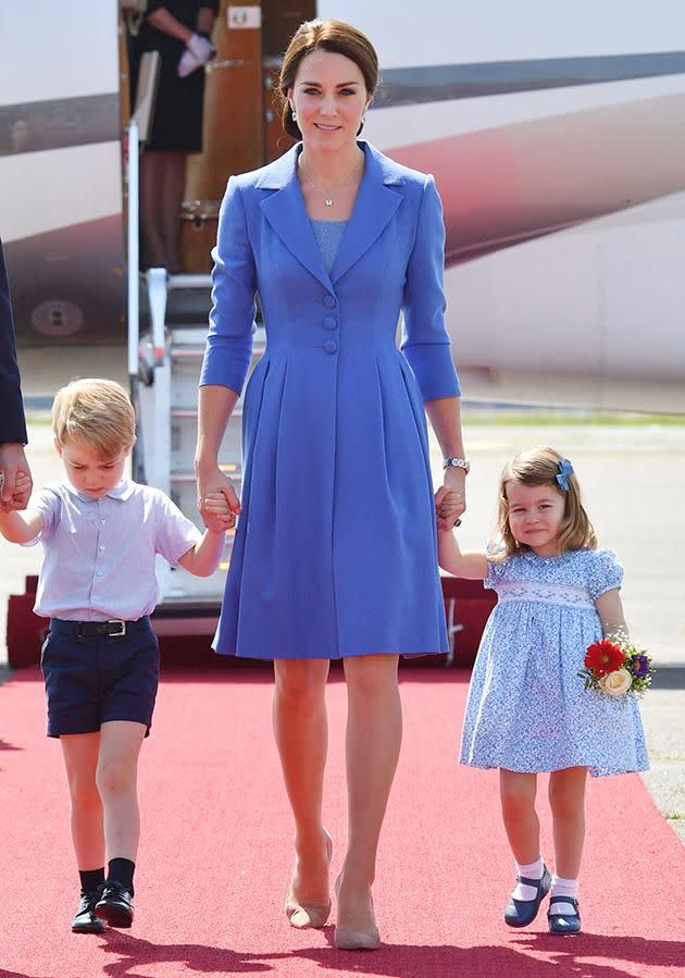 She held hands with her mum, Kate Middleton, as she got off the plane. Photo: Getty Images