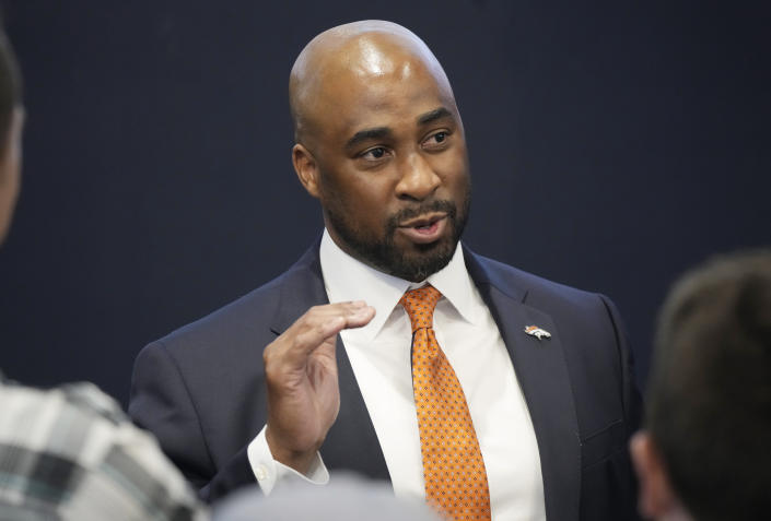 Damani Leech, the new president of the Denver Broncos, talks with reporters after an introductory news conference at the NFL football team's headquarters Monday, Aug. 29, 2022, in Centennial, Colo. (AP Photo/David Zalubowski)