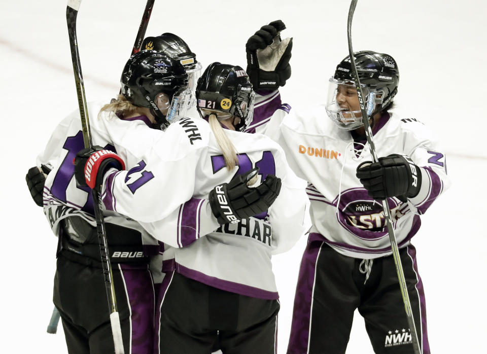 FILE- In this Feb. 10, 2019, file photo, Team Szabados forward Audra Richards (21) is congratulated after scoring a goal against Team Stecklein in the NWHL All-Star Hockey Game in Nashville, Tenn. The women's hockey league thinks it can make it work with the same kind of COVID-19 testing the NBA used in its Disney World bubble. Players, coaches and staff will essentially be limited to hotel and Herb Brooks Arena, the site of the 1980 “Miracle on Ice” that serves as a historic setting for a unique season. (AP Photo/Mark Humphrey, File)