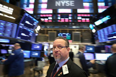 FILE PHOTO: Traders work on the floor of the New York Stock Exchange (NYSE) in New York, U.S., February 19, 2019. REUTERS/Brendan McDermid