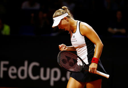 Tennis - Fed Cup - World Group Semi Final - Germany vs Czech Republic - Porsche Arena, Stuttgart, Germany - April 22, 2018 Germany’s Angelique Kerber celebrates during her singles match against Czech Republic’s Petra Kvitova REUTERS/Kai Pfaffenbach