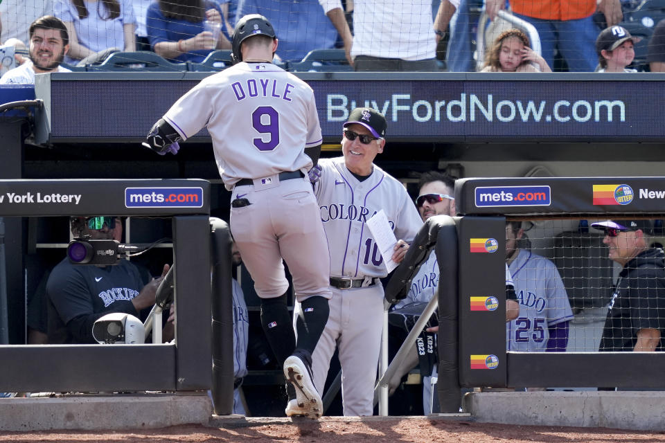 Colorado Rockies' Brenton Doyle (9) celebrates his two-run home run with manager Bud Black (10) in the fifth inning of a baseball game against the New York Mets, Sunday, May 7, 2023, in New York. (AP Photo/John Minchillo)