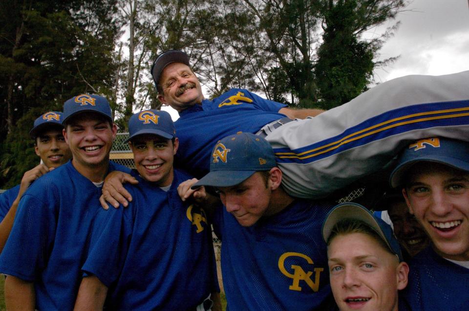 04/09/03 -- Cardinal Newman baseball coach Jack Kokinda and members of his team Wednesday at baseball practice. Kokinda has been with Newman for 33 years; he will be inducted into the Palm Beach County Sports Hall of Fame Sunday night. BRUCE R. BENNETT/Staff Photographer Palm Beach County Sports Hall of Fame ORG XMIT:   ORG XMIT: MER0709061226240192