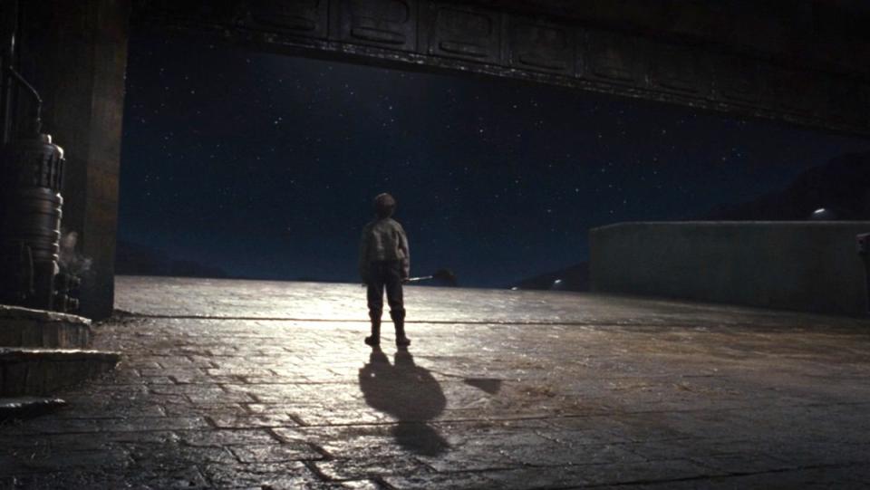 Broom Boy looks out at the stars at the end of The Last Jedi