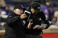 New York Mets manager Buck Showalter (11) talks with home plate umpire Ryan Wills during the ninth inning of the team's baseball game against the Philadelphia Phillies on Friday, April 29, 2022, in New York. The Mets won 3-0. (AP Photo/Adam Hunger)