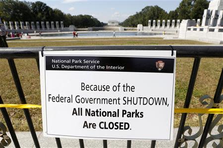 A closure sign is seen on a barricade at the World War Two Memorial in Washington October 1, 2013. REUTERS/Kevin Lamarque