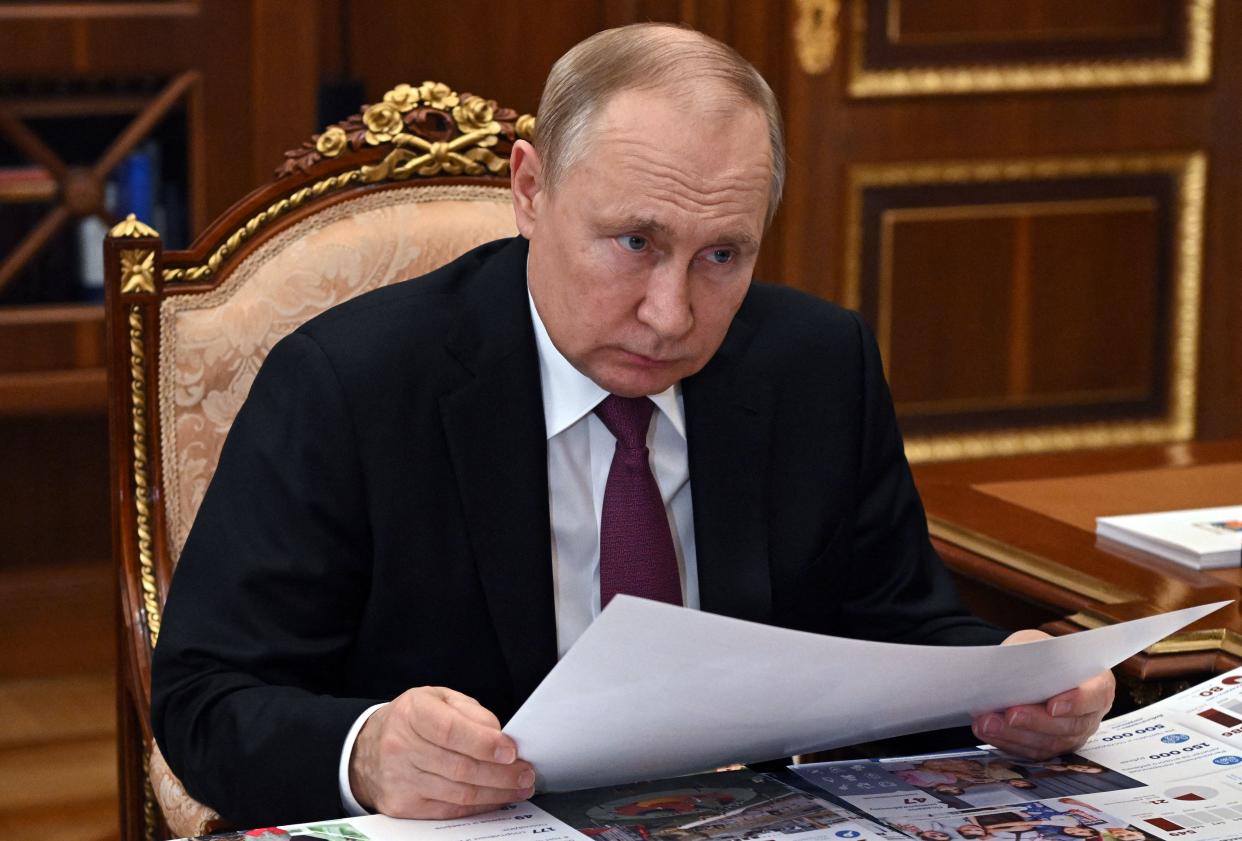 Russian President Vladimir Putin meets with Governor of Russia's Yamalo-Nenets Autonomous Region Dmitry Artyukhov at the Kremlin in Moscow on March 21, 2022. (Photo by Mikhail Klimentyev / Sputnik / AFP) (Photo by MIKHAIL KLIMENTYEV/Sputnik/AFP via Getty Images)