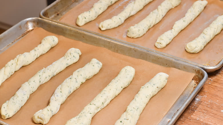 breadsticks proofing on trays