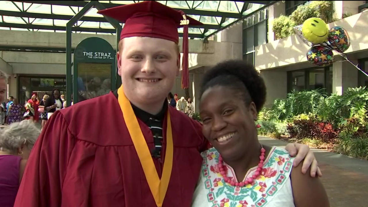 Elementary school teacher returns for former students graduation 9 years later (Credit: FOX13)