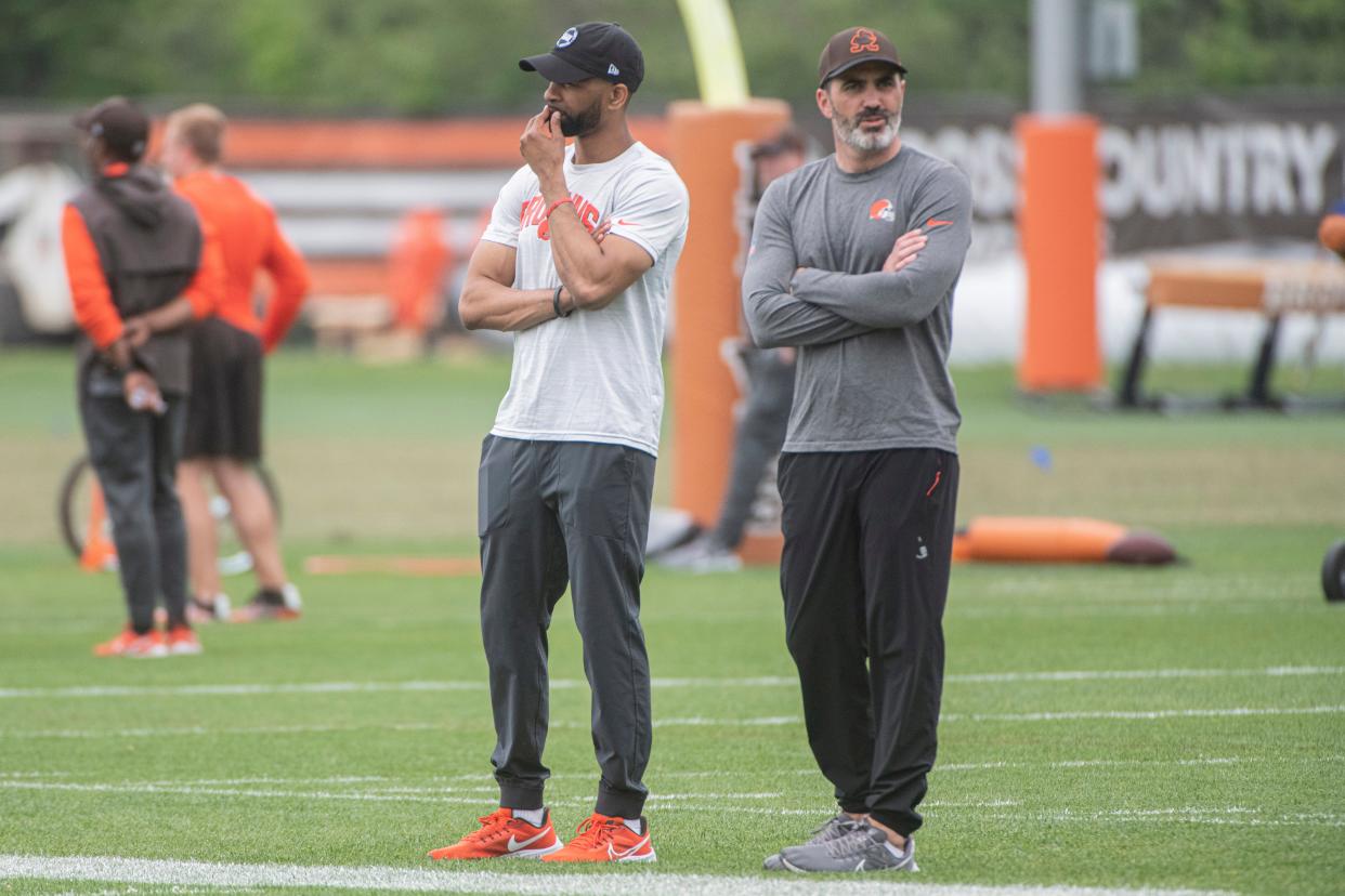 Browns general manager Andrew Berry, left, and head coach Kevin Stefansk watch the team's rookie minicamp in Berea, Saturday, May 13, 2023.