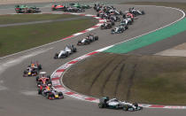 Mercedes driver Lewis Hamilton of Britain leads the field into turn three at the start of the Chinese Formula One Grand Prix at Shanghai International Circuit in Shanghai, Sunday, April 20, 2014. (AP Photo/Eugene Hoshiko)