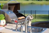 Invest in an outdoor kitchen complete with a sink and refrigerator. They're available from barbecue specialist retailers.