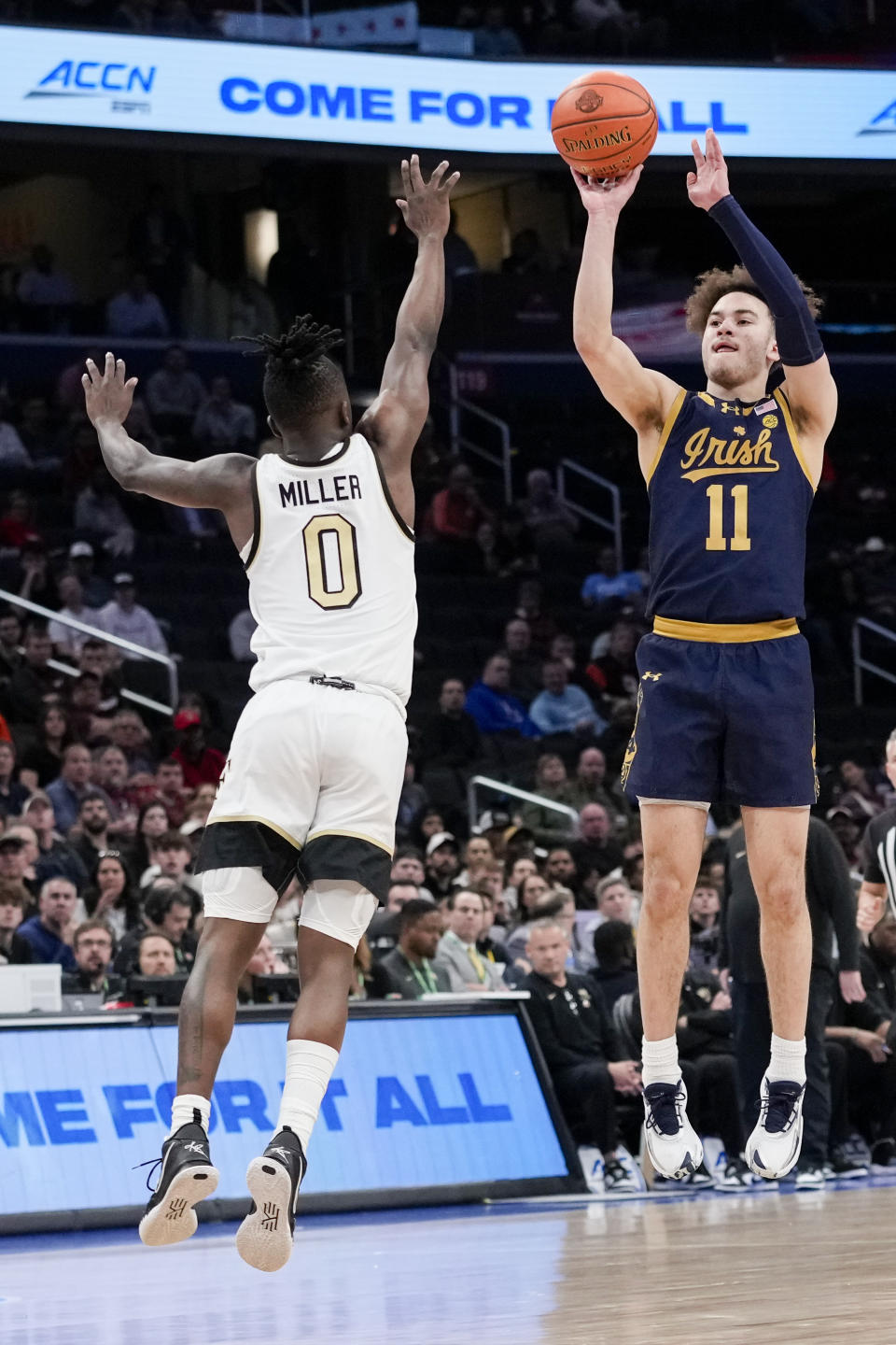 Notre Dame guard Braeden Shrewsberry (11) shoots over Wake Forest guard Kevin Miller (0) during the second half of the Atlantic Coast Conference second round NCAA college basketball tournament game Wednesday, March 13, 2024, in Washington. (AP Photo/Susan Walsh)