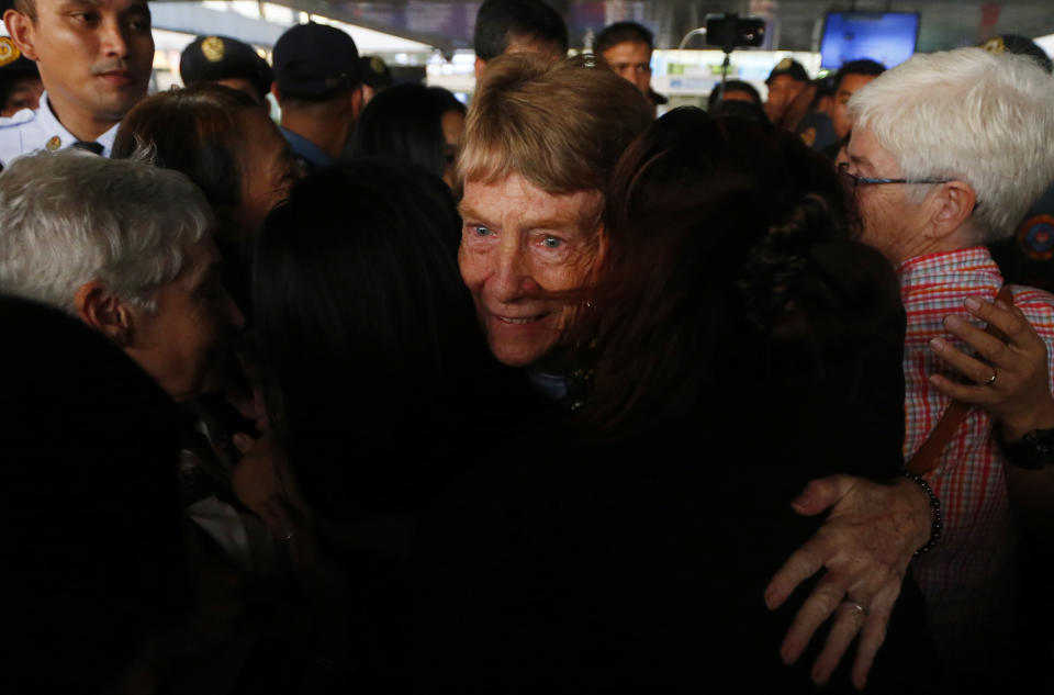 Australian Roman Catholic nun Sister Patricia Fox hugs to bid goodbye to supporters as she is escorted to the Ninoy Aquino International Airport for her flight to Australia Saturday, Nov. 3, 2018, in Manila, Philippines. Sister Fox decided to leave after 27 years in the country after the Immigration Bureau denied her application for the extension of her visa. Sr. Fox called on Filipinos to unite and fight human rights abuses ahead of her forced departure from the country. (AP Photo/Bullit Marquez)