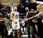 <p>Stephen Curry walks off the basketball court after the Golden State Warriors defeat the Phoenix Suns on Christmas Day in Phoenix, Arizona.</p>