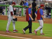 Roy Halladay leaves the game after facing just three batters, the shortest outing of his career, and the last appearance of his career.