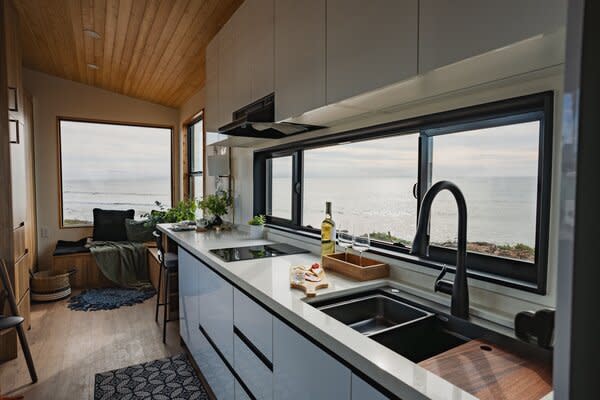 The kitchen comes with 12-foot quartzite countertops and a cooktop.