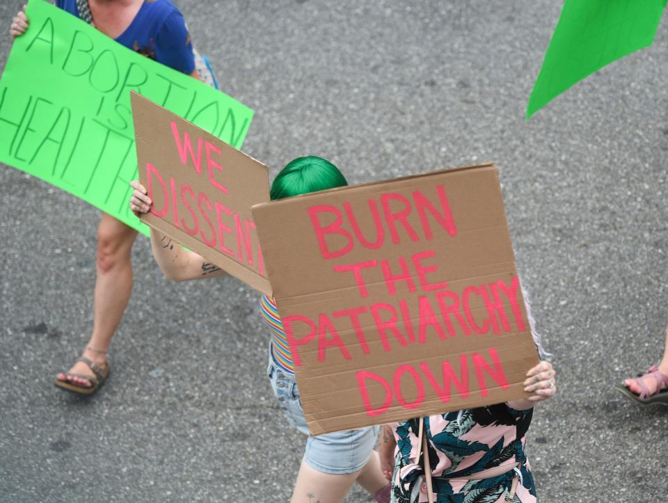 Demonstrators march during a rally in in downtown Knoxville in support of abortion rights and in response to the the overturning of Roe v. Wade on Sunday, June 26, 2022. The U.S. Supreme Court ruled 6-3 Friday that Americans no longer have a constitutional right to abortion and erased a reproductive right the high court established nearly five decades ago.