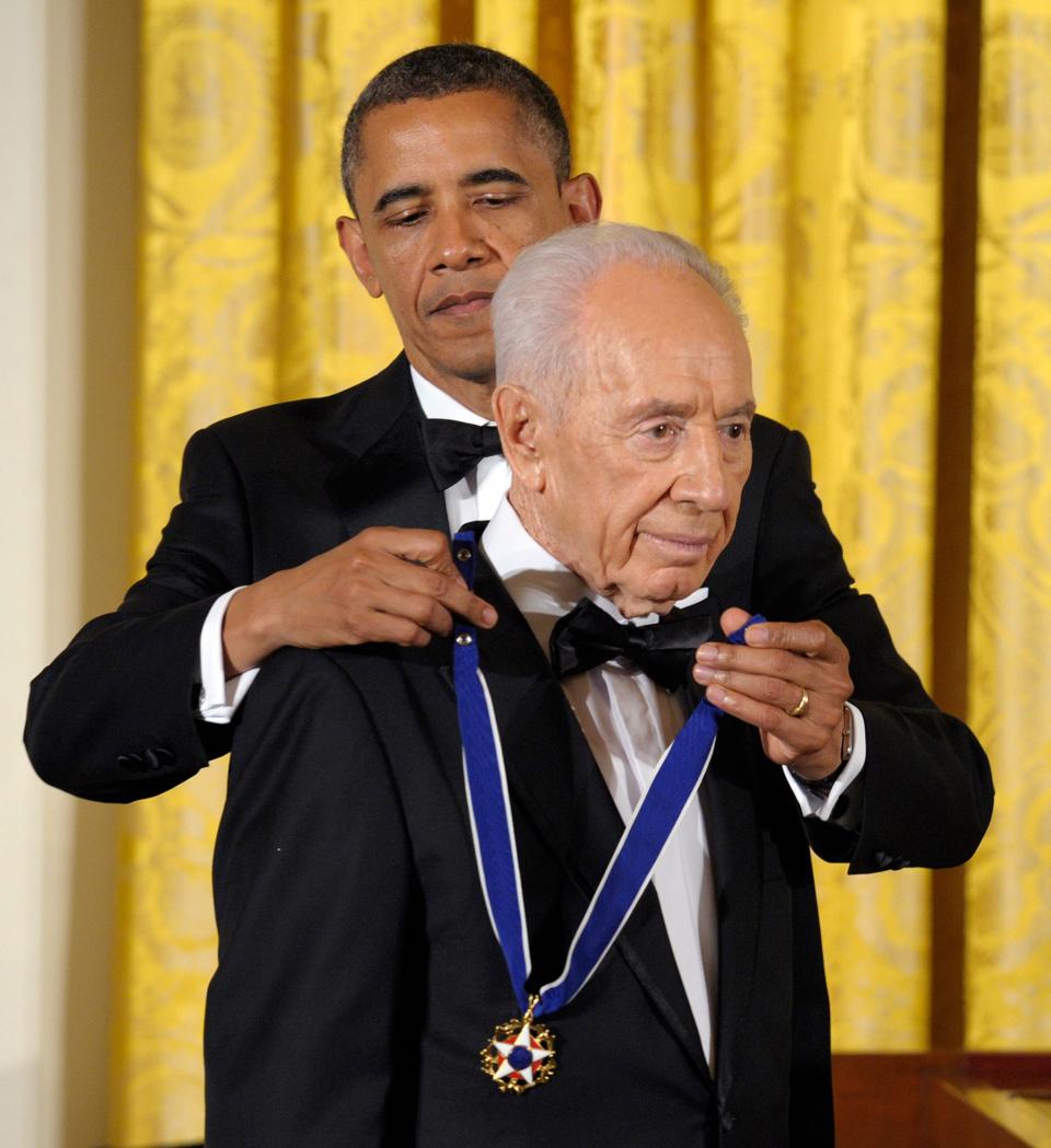 <p>President Barack Obama awards Israeli President Shimon Peres with the Presidential Medal of Freedom at a dinner at the East Room of the White House in Washington, Wednesday, June 13, 2012. (AP Photo/Susan Walsh) </p>