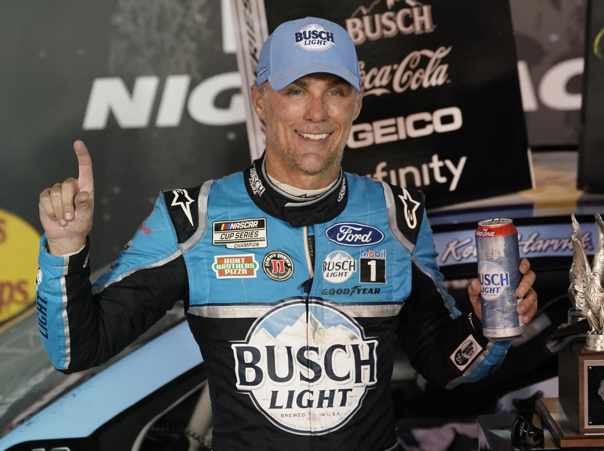 Kevin Harvick celebrates in Victory Lane after winning the NASCAR Cup Series auto race Saturday, Sept. 19, 2020, in Bristol, Tenn. (AP Photo/Steve Helber)