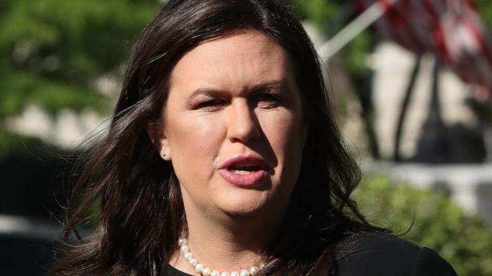 This 2019 photo shows then-White House Press Secretary Sarah Huckabee Sanders talking to reporters after an interview with Fox News outside the West Wing. (Photo by Mark Wilson/Getty Images)