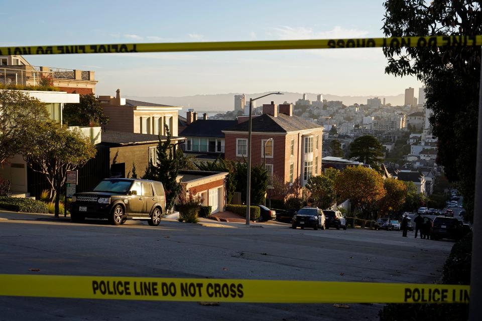 Police tape blocks a street outside the home of Paul Pelosi, the husband of House Speaker Nancy Pelosi, in San Francisco. Paul Pelosi was attacked in the home early Friday.