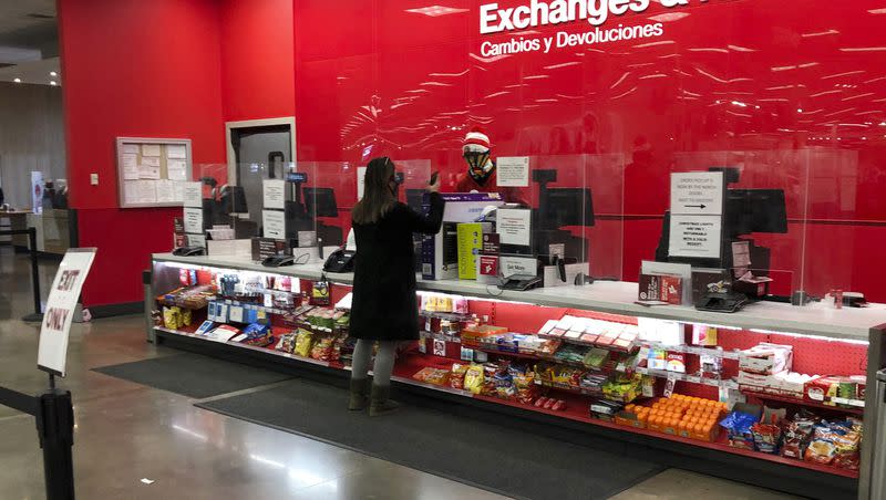 A customer is shown at the exchanges and return counter in a Target department store early Wednesday, Dec. 23, 2020, in Glendale, Colo. As returns get more expensive, companies are doing away with their old free return policies.