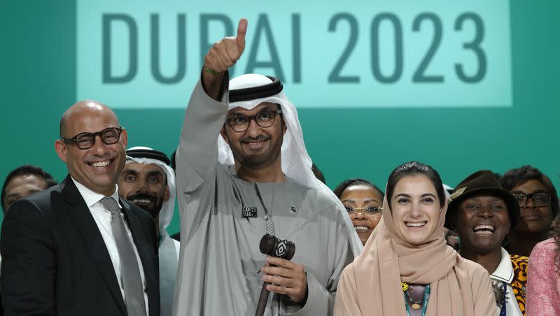 United Nations Climate Chief Simon Stiell, from left, COP28 President Sultan al-Jaber and Hana Al-Hashimi, chief COP28 negotiator for the United Arab Emirates, pose for photos at the end of the COP28 U.N. Climate Summit on Wednesday, Dec. 13, 2023, in Dubai, United Arab Emirates.