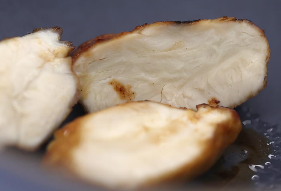 A piece of Good Meat's cultivated chicken is displayed at the Eat Just office on July 27, 2023, in Alameda, California. Back in June, the U.S. Department of Agriculture (USDA) authorized two California-based companies, Upside Foods and Good Meat, to sell chicken grown from cells in a lab. Cell-cultivated or lab-grown meat is made by feeding nutrients to animal cells in stainless steel tanks.