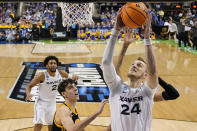 Xavier forward Jack Nunge scores against Pittsburgh forward Guillermo Diaz Graham during the second half of a second-round college basketball game in the NCAA Tournament on Sunday, March 19, 2023, in Greensboro, N.C. (AP Photo/Chris Carlson)