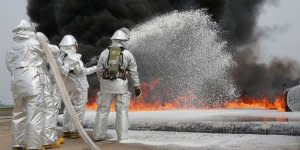 Marines fighting fires with foam