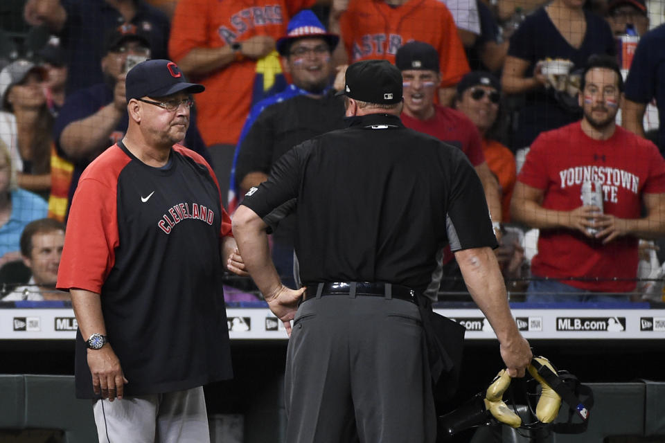 Cleveland Indians manager Terry Francona, left, talks with umpire Bruce Dreckman after a solo home run by Houston Astros' Jose Altuve during the third inning of a baseball game Tuesday, July 20, 2021, in Houston. (AP Photo/Eric Christian Smith)