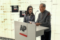 Rao Jian, right, son of Y.C. Jao, speaks during a ceremony at the Associated Press headquarters, in New York, Wednesday, Dec. 11, 2019, honoring Jao for his service as a Chinese correspondent working for the AP in China at the time of the Communist Red Army's victory over Nationalist forces and its conquest of China. Jao continued to work for AP in Nanjing even after American correspondents were evicted from the country. His passion for journalism led to his execution in 1951. (AP Photo/ Chuck Zoeller)