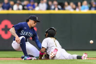 Oakland Athletics' Esteury Ruiz (1) collides into Seattle Mariners second baseman Kolten Wong during the first inning of a baseball game, Tuesday, May 23, 2023, in Seattle. (AP Photo/Caean Couto)