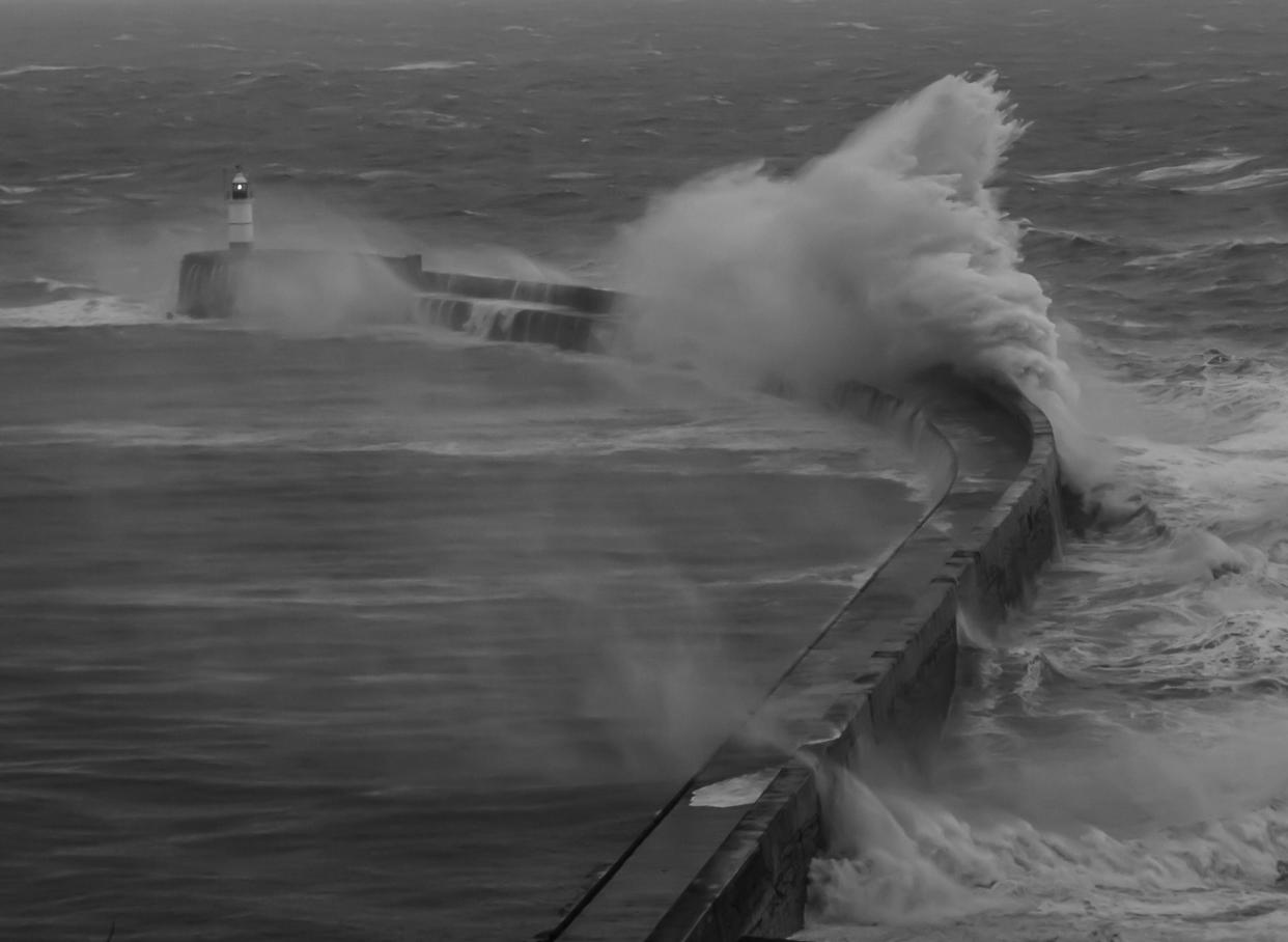 Newhaven, East Sussex, UK. 2nd Jan, 2024. More spectacular scenes off the channel coast at Newhavens West arm lighthouse as Storm Henk whips up the surf with stronger winds than recent Storm Gerrit. This picture monochrome. Much disruption in the area due to fallen trees & flooding. Credit: David Burr/Alamy Live News