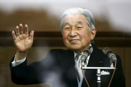 Japan's Emperor Akihito waves to well-wishers who gathered at the Imperial Palace to mark his 82nd birthday in Tokyo, Japan, December 23, 2015. REUTERS/Thomas Peter/File photo