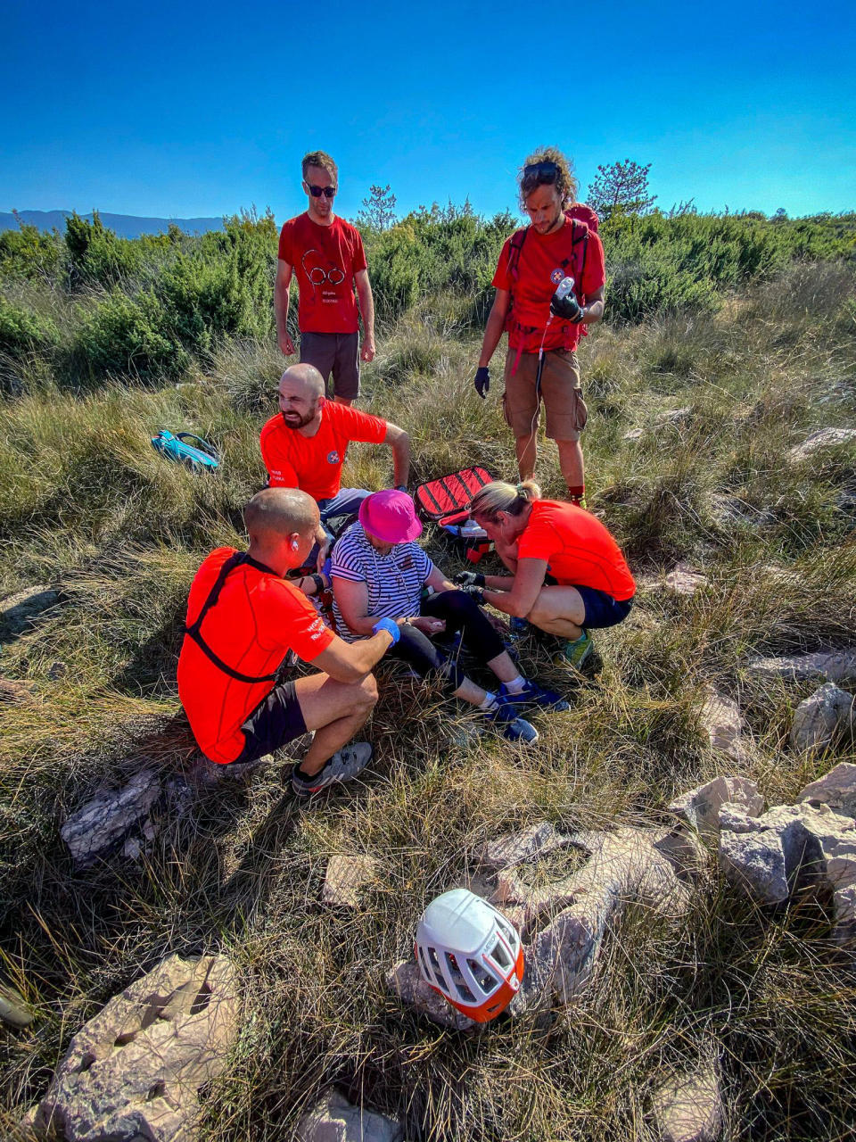 This photo provided by the Croatian Mountain Rescue Service, shows the rescue operation of an unidentified woman who was found on the Adriatic island of Krk on Sept. 12, 2021. Croatian police said Tuesday, Sept. 21, 2021 they are still working to establish the identity of a woman found over a week ago at a northern Adriatic Sea island with no recollection of who she is or where she came from. Police told the Associated Press they are searching the terrain and conducting numerous interviews with residents and tourists or anyone who has information about the woman discovered on the island of Krk on Sept. 12. (Croatian Mountain Rescue Service via AP)