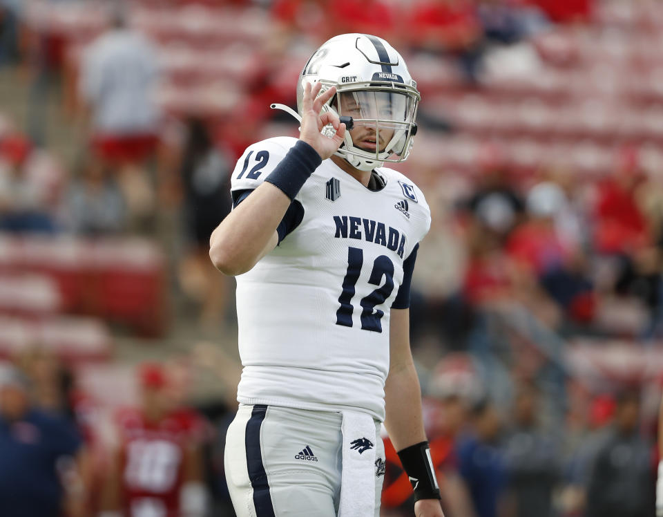 Nevada quarterback Carson Strong signals to the sideline against Fresno State during the first half of an NCAA college football game in Fresno, Calif., Saturday, Oct. 23, 2021. (AP Photo/Gary Kazanjian)