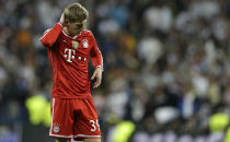 Bayern's Toni Kroos touches his head after a Champions League semifinal first leg soccer match between Real Madrid and Bayern Munich at the Santiago Bernabeu stadium in Madrid, Spain, Wednesday, April 23, 2014. (AP Photo/Paul White)