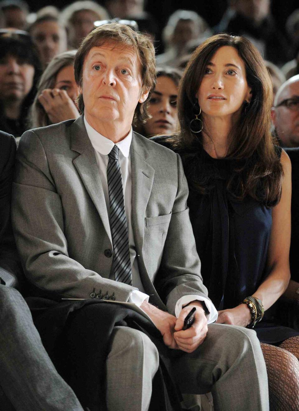 Paul McCartney and Nancy Shevell attend the Stella McCartney Ready-to-Wear Autumn/Winter 2009/2010 fashion show during Paris Fashion Week at Carreau du Temple in Paris